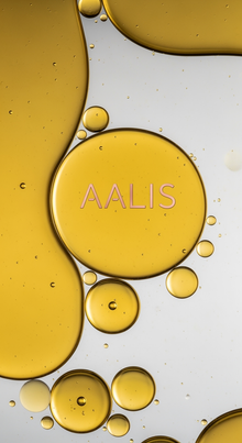 AALIS Dayana Micellar Water gently removing makeup on a model's cheek.